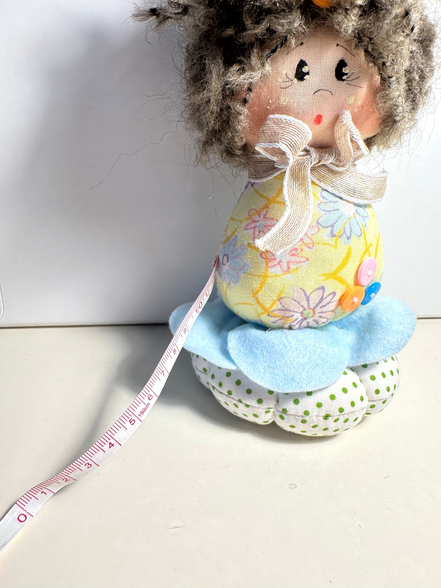 Doll with tape measure and pincushion