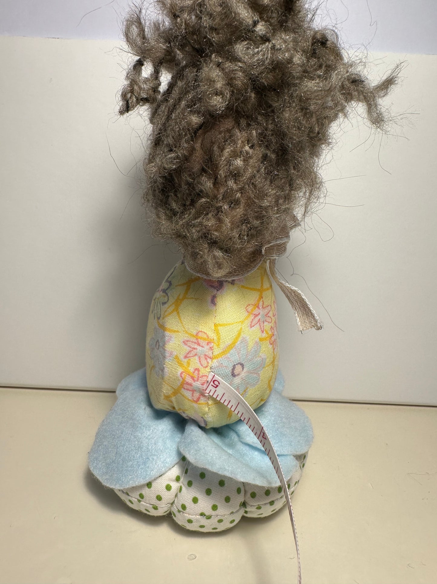 Doll with tape measure and pincushion