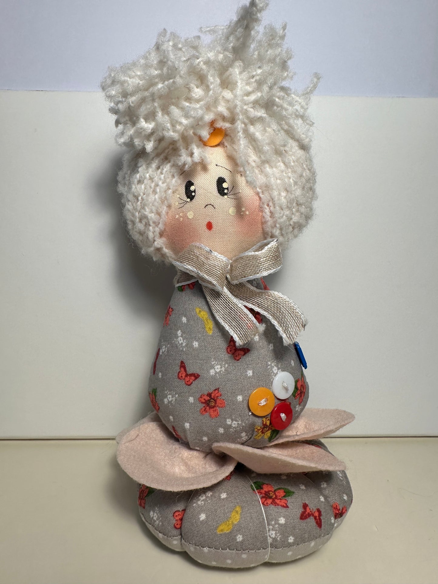 Doll with tape measure and pincushion