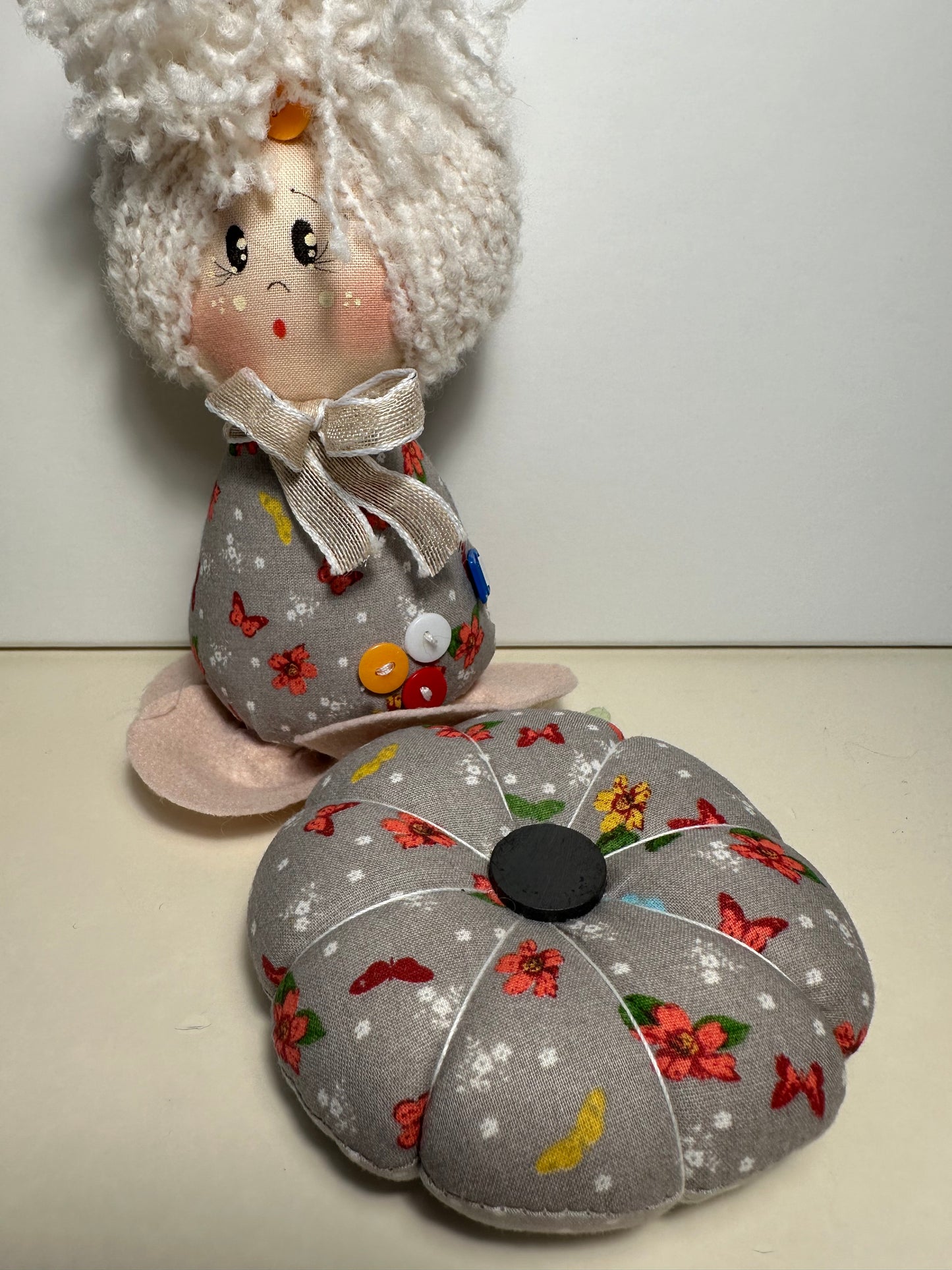 Doll with tape measure and pincushion