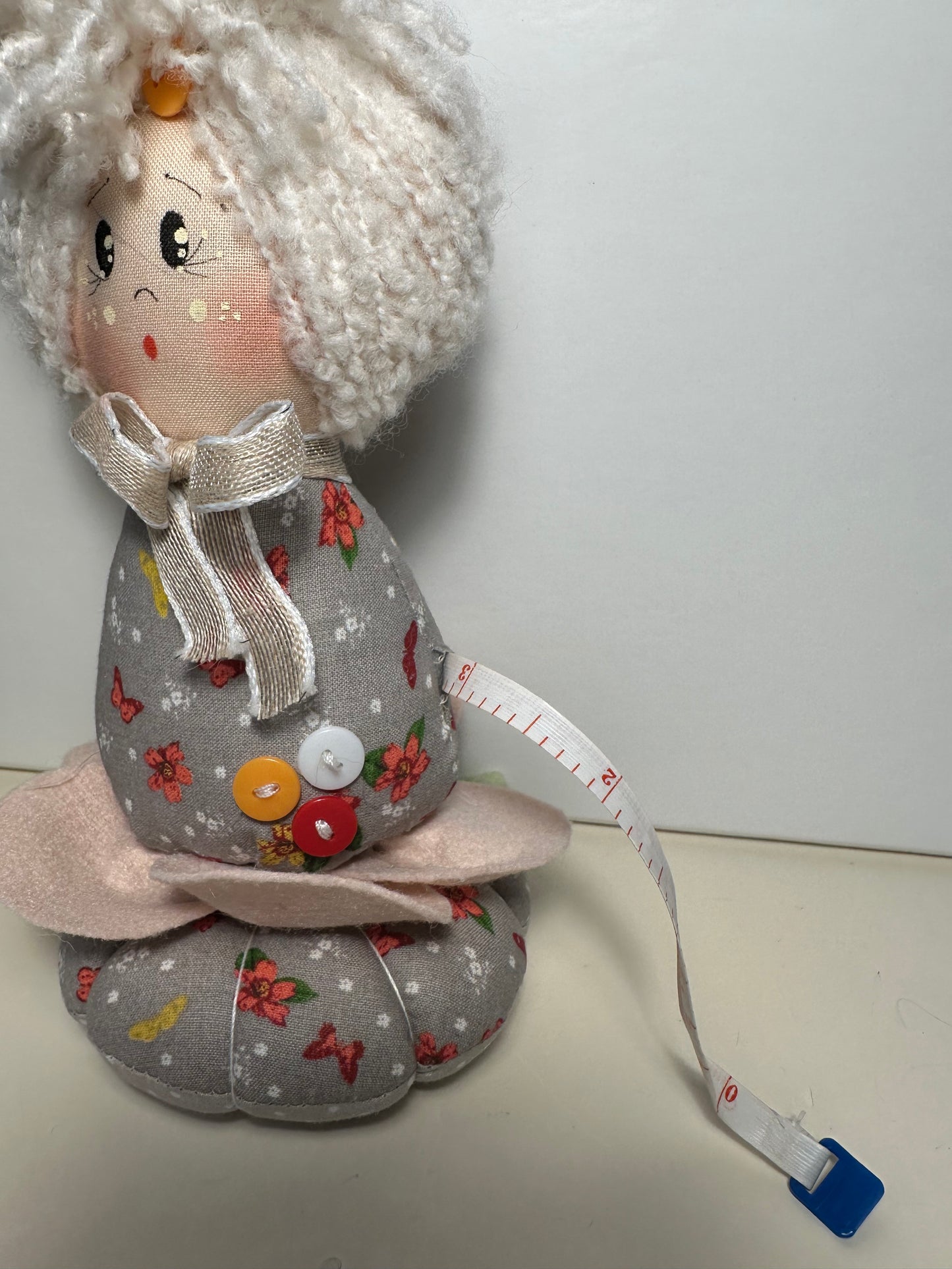 Doll with tape measure and pincushion