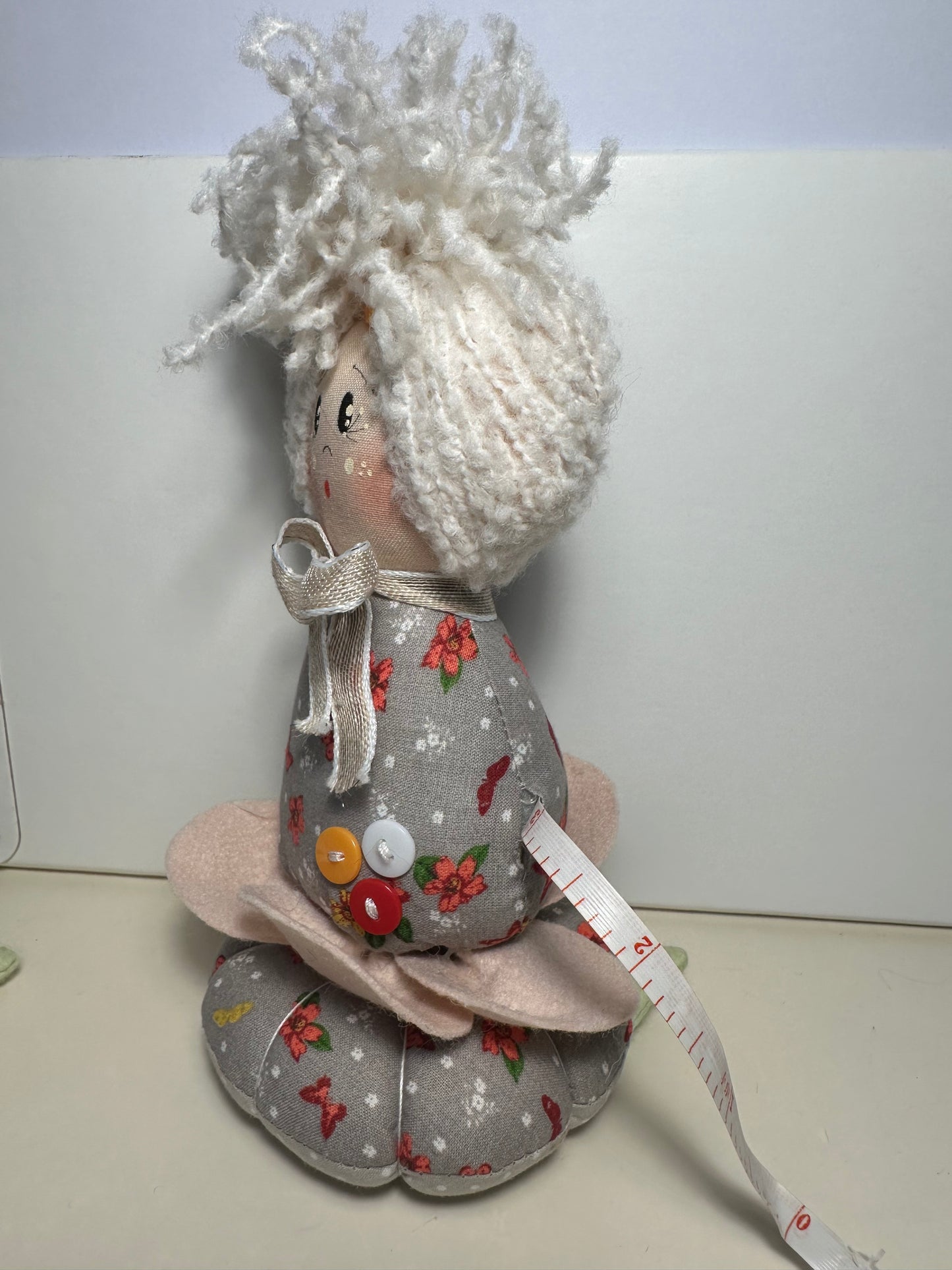 Doll with tape measure and pincushion